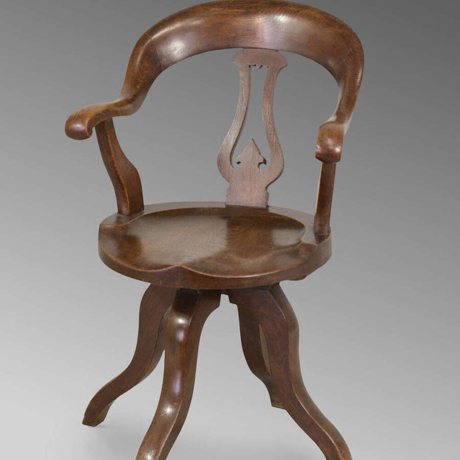 Bergere swivel chair in oak c1900